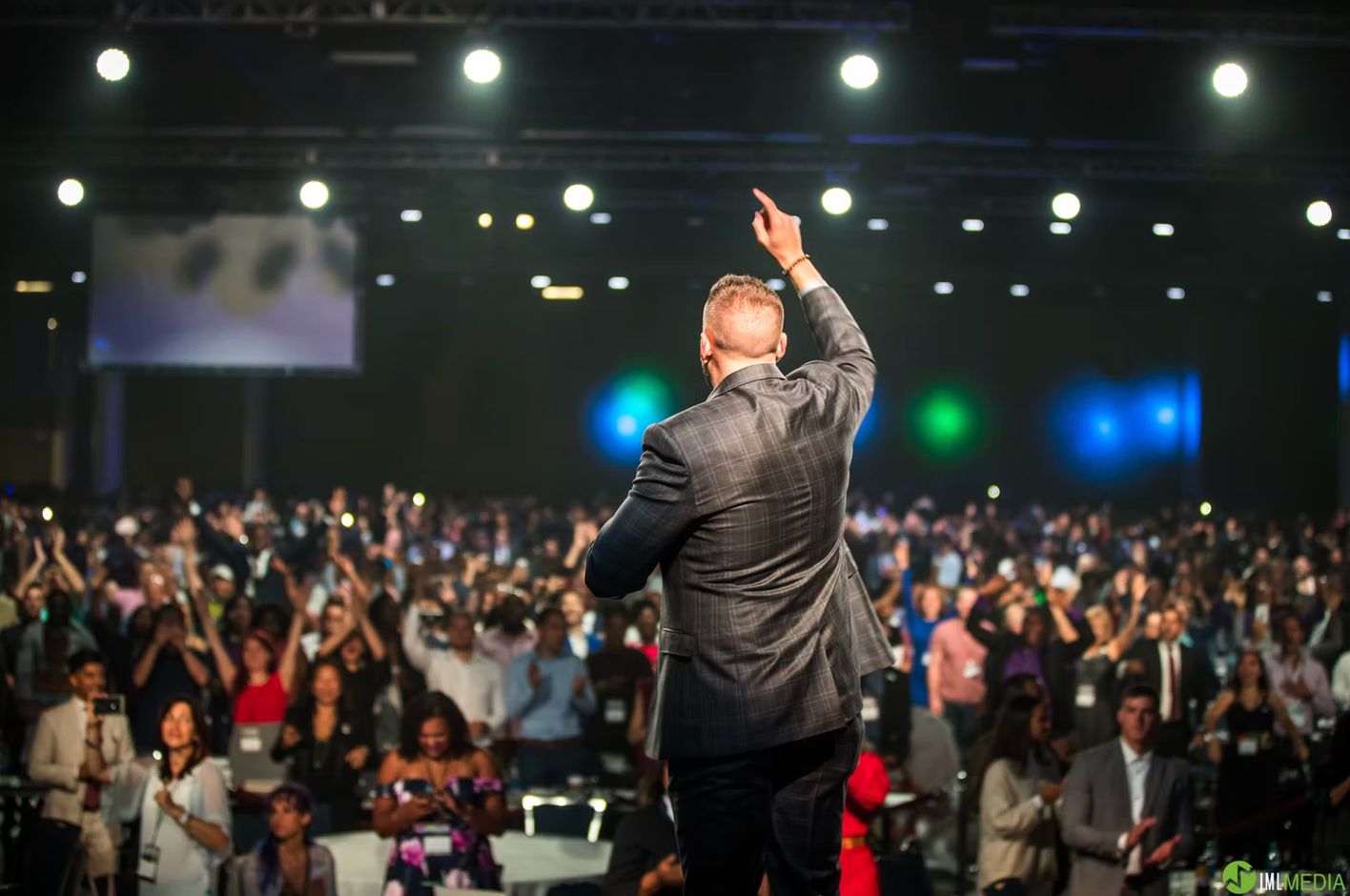 Event videography in Southern California — speaker on stage at a live event filmed by Murrieta Media