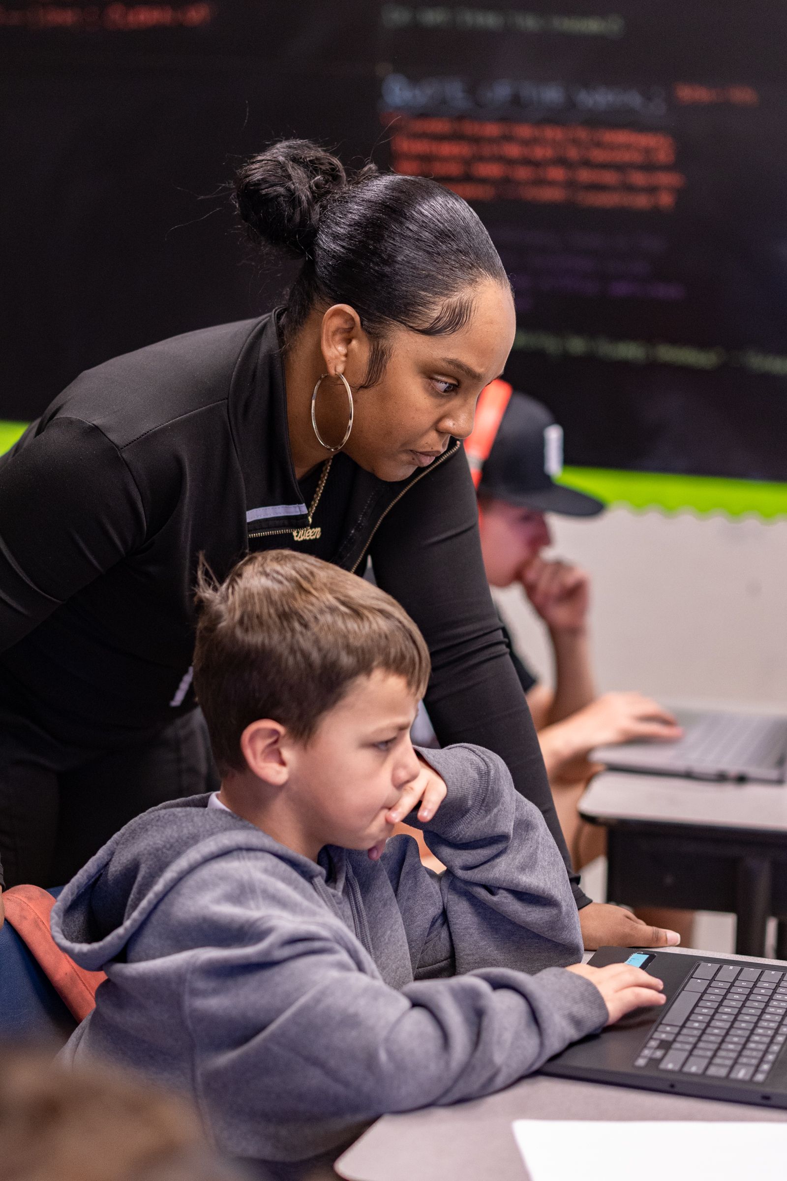 Empire Sports Academy tutor helping young athlete in the classroom — Murrieta youth sports academy photographed by Murrieta Media