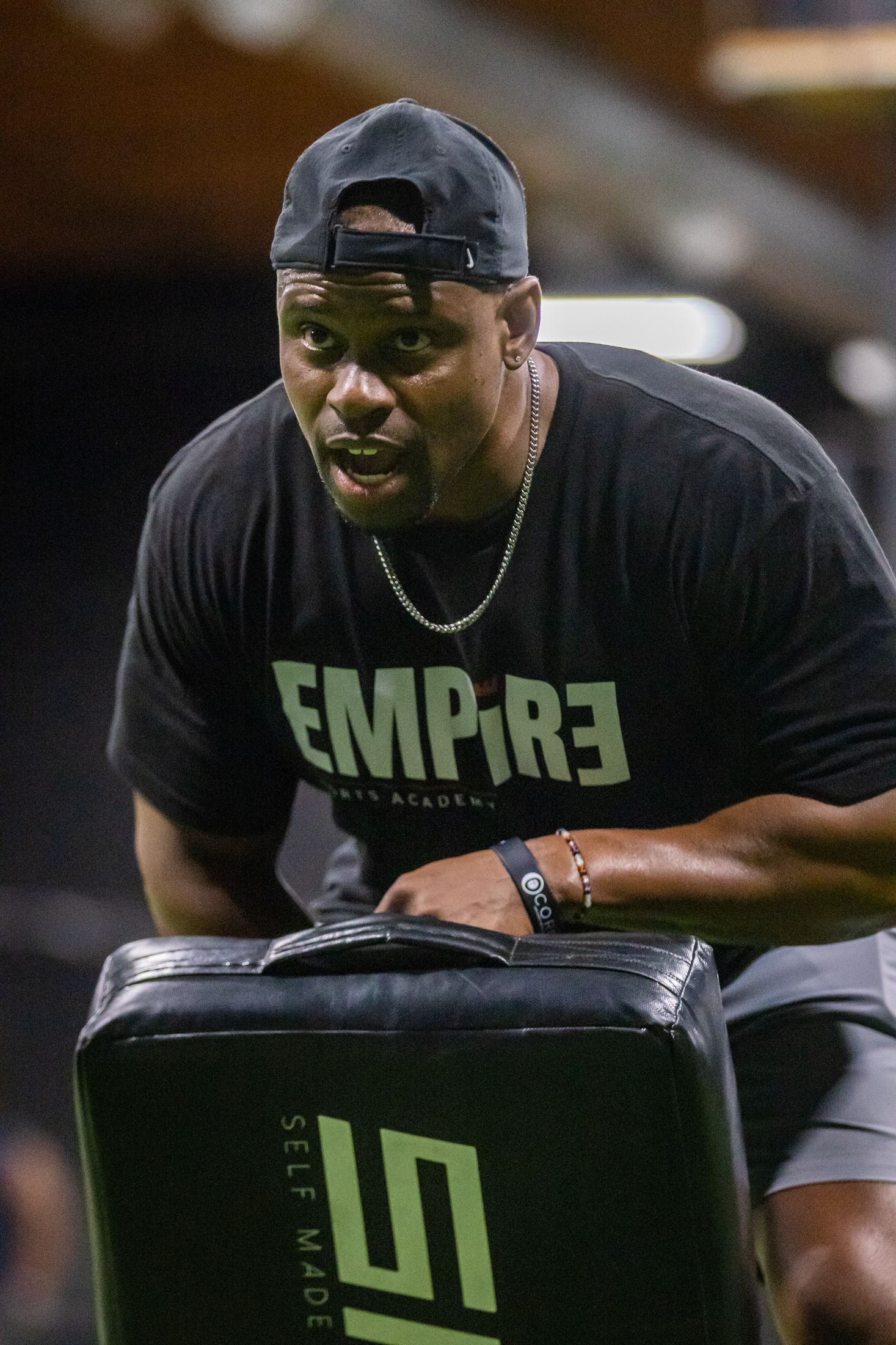 Empire Sports Academy coach with training pad firing up athletes — sports media content by Murrieta Media, Temecula Valley