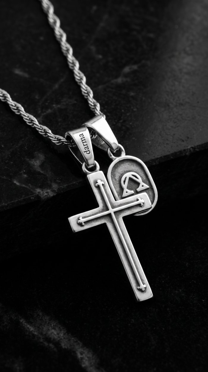 Darma silver cross pendant necklace on black marble — jewelry product photography by Murrieta Media